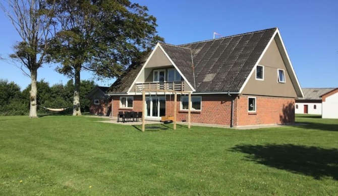 House in green nature with small sports hall